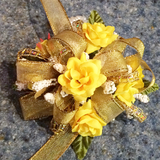 Yellow rose wristlet with gold bow