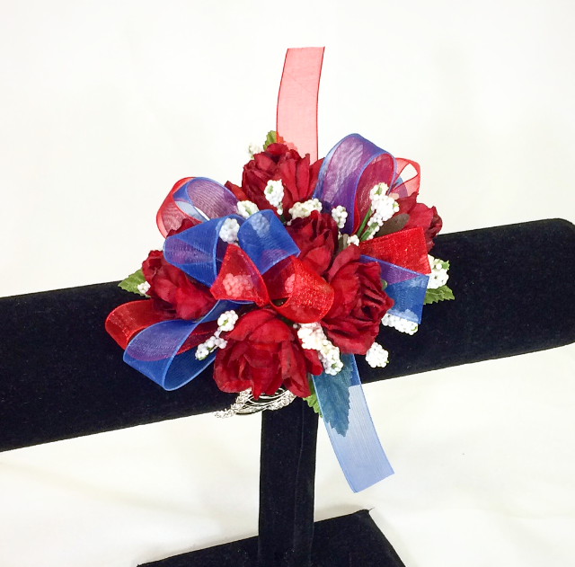 Red rose wristlet with a red & blue bow