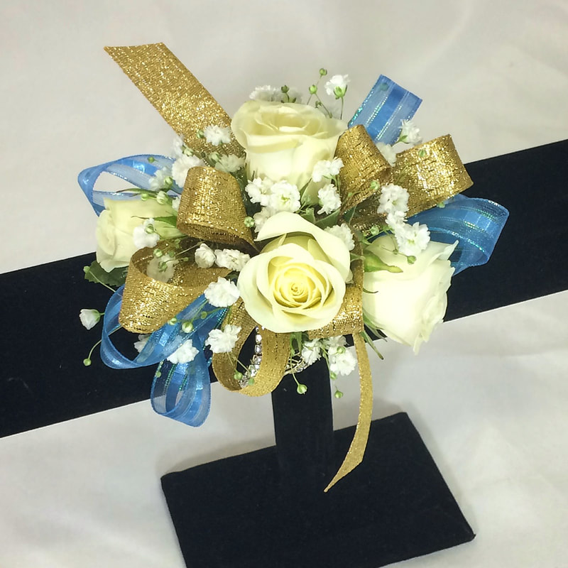 White rose wristlet with gold and blue bow