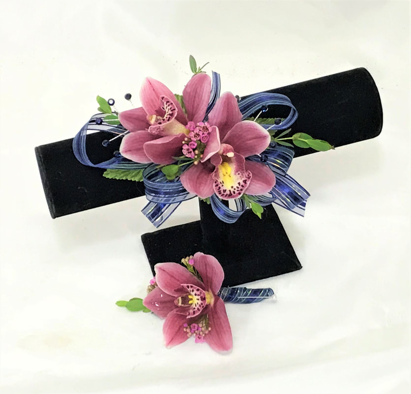 Pink orchid corsage and boutonniere