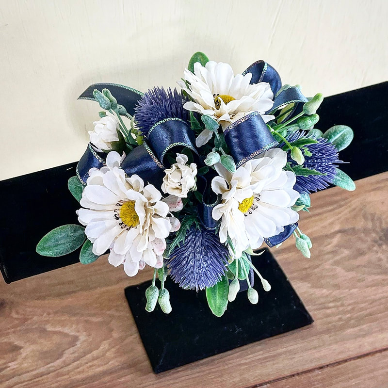 Blue orchid corsage and bout with silver ribbon