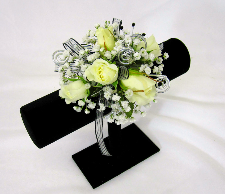 White rose wristlet with silver curls 