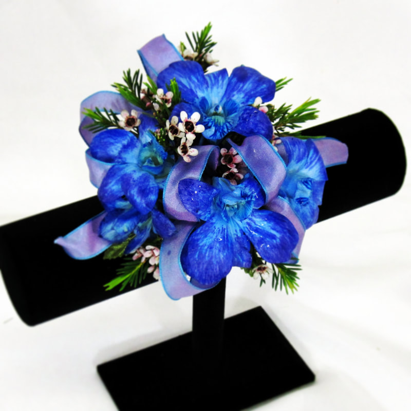 Blue orchid corsage