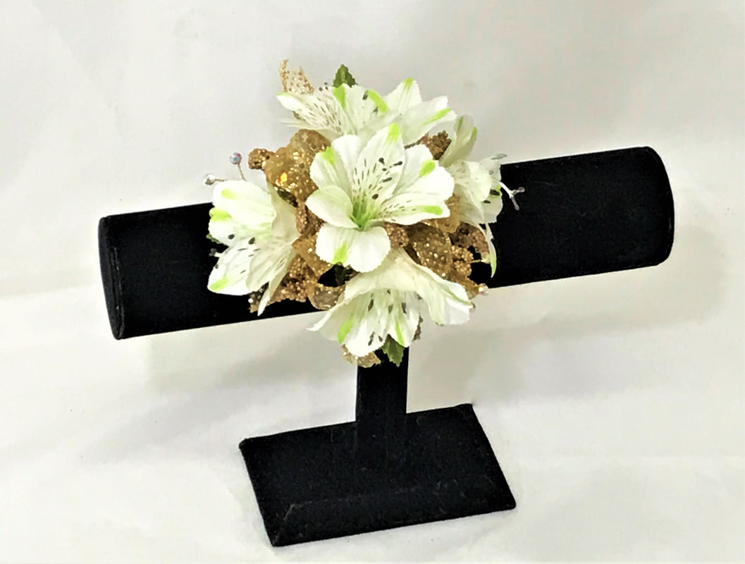 White Alstro corsage with gold ribbon