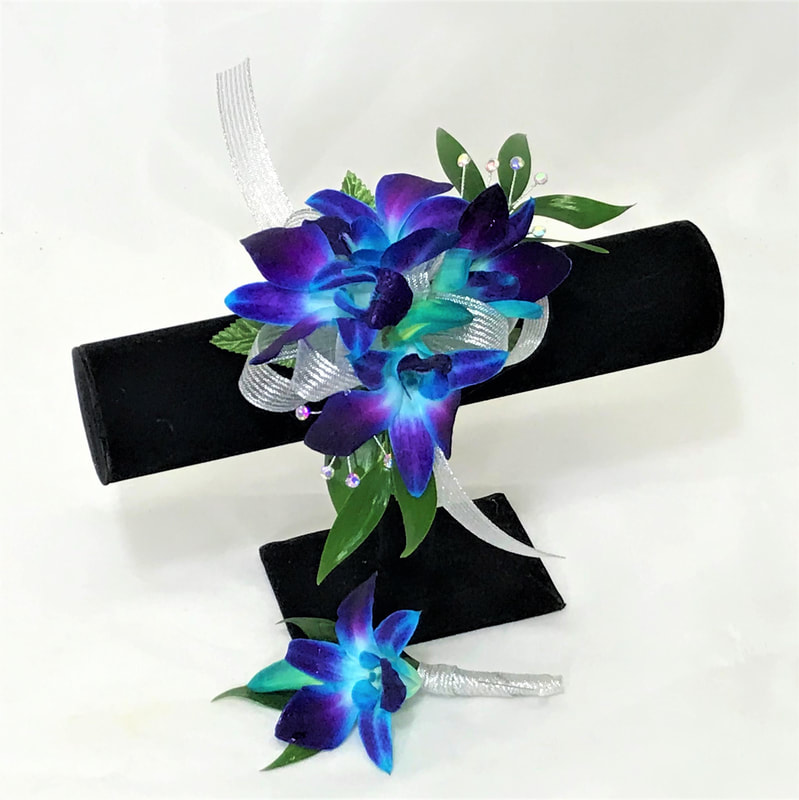 Blue orchid corsage and bout with silver ribbon