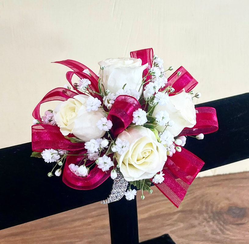 White rose corsage with hot pink ribbon